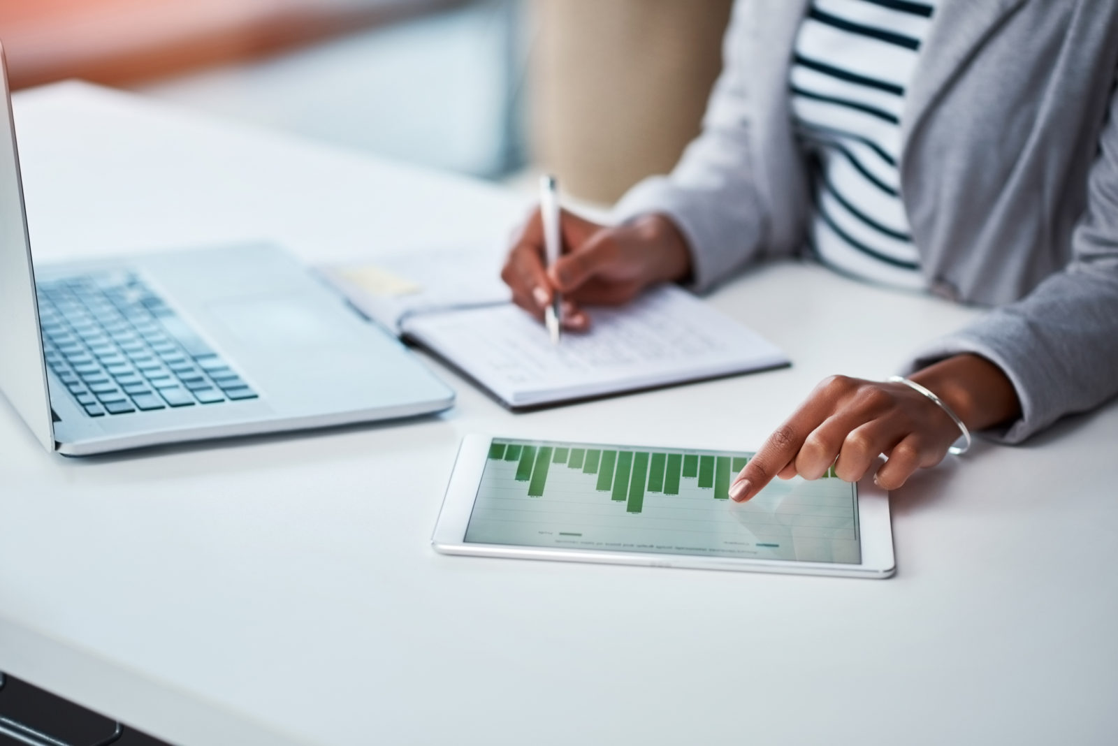 Businesswoman working on tablet with computer